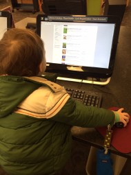 Looking up Ninjago books at the library.